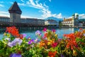 Flowery waterfront and Chapel bridge on the Reuss river Lucerne