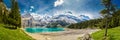 Amazing tourquise Oeschinnensee with waterfalls, wooden chalet and Swiss Alps, Berner Oberland, Switzerland Royalty Free Stock Photo