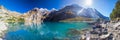 Amazing tourquise Oeschinnensee with waterfalls, wooden chalet and Swiss Alps, Berner Oberland, Switzerland Royalty Free Stock Photo