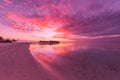 Amazing tropical beach sunrise or sunset landscape, luxury water villas and mirror reflection and colorful sky. Royalty Free Stock Photo
