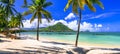 Amazing tropical scenery of beautiful beach and mountain view. Flic en Flac, Mauritius island Royalty Free Stock Photo