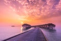Amazing tropical sunset beach with luxury water villas at Maldives. Tropical twilight landscape Royalty Free Stock Photo