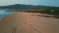 Amazing twilight seascape drone view. Ocean waves washing beautiful sandy shore Royalty Free Stock Photo