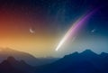 Amazing unreal background: giant colorful comet in glowing sunset sky over mountains. Comet is icy small Solar System body