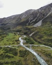 Amazing vertical shot of a bridge in a mountain landscape