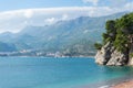 Amazing view on the Adriatic sea and mountains from Montenegro. Rocky cliff in clean turquoise water in beach of Budva. View of Royalty Free Stock Photo