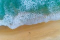 Amazing view aerial view drone camera photo of waves crashing on sandy shore,top view of beautiful sandy beach in the morning Royalty Free Stock Photo