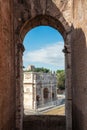 Amazing view of the Arch of Constantine framed from Colisseums arch windows