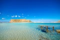 Amazing view of Balos Lagoon with magical turquoise waters, lagoons, tropical beaches of pure white sand and Gramvousa island. Royalty Free Stock Photo