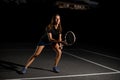 view on beautiful active woman with racket in special pose which preparing to hit Royalty Free Stock Photo