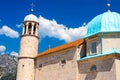 Amazing view of the church with a blue bath on the island of the Virgin on a reef in the Bay of Kotor, Montenegro Royalty Free Stock Photo