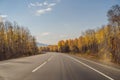 Amazing view with colorful autumn forest with asphalt mountain road. Beautiful landscape with empty road, trees and Royalty Free Stock Photo