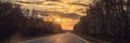 Amazing view with colorful autumn forest with asphalt mountain road. Beautiful landscape with empty road, trees and Royalty Free Stock Photo