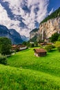 Amazing view of famous Lauterbrunnen town in Swiss Alps valley with beautiful Staubbach waterfalls in the background, Switzerland Royalty Free Stock Photo