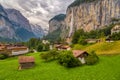 Amazing view of famous Lauterbrunnen town in Swiss Alps valley with beautiful Staubbach waterfalls, Switzerland Royalty Free Stock Photo