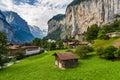 Amazing view of famous Lauterbrunnen town in Swiss Alps valley with Staubbach waterfalls in the background, Switzerland Royalty Free Stock Photo