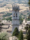 Amazing view from the hill to the old tower of the medieval town of Assisi. Italy, August 2012