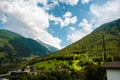 Amazing view of the hillside village and green slopes of the Swiss Alps. Colorful summer view of village. Idyllic Royalty Free Stock Photo