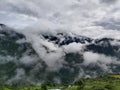 Amazing View of Himalayan mountains with light cloud over the mountains which make nice scene to view with great vegetation