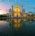 Amazing view of Karlskirche with illumination and reflection in the water, Vienna, Austria Royalty Free Stock Photo