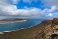 Amazing view on La Graciosa island from Mirador del Rio on a cloudy day, Lanzarote, Spain Royalty Free Stock Photo