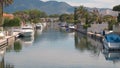 Amazing view on marine canal with boats and houses at summer.