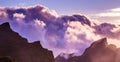 Amazing view of mountain peaks with beautiful clouds on the sunset. Location: Tenerife, Canary Islands, Spain. Artistic picture. Royalty Free Stock Photo