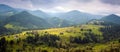 Amazing view of the mountain village Dzembronya foggy morning in the mountains in summer. Royalty Free Stock Photo