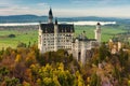 Amazing view of Neuschwanstein castle in autumn season at sunset. Bavaria, Germany. Neuschwanstein castle one of the most popular Royalty Free Stock Photo