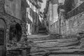 Amazing view of old natural stone street with a fountain in ancient medieval village of Rupit, Barcelona , Spain.Black and white Royalty Free Stock Photo