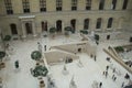 Amazing view overlooking open courtyard with sightseers enjoying the day,The Louvre,Paris,France,2016