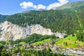 Amazing view of picturesque Swiss village Lauterbrunnen in summer from above. Famous Staubbach Falls. Swiss Alps. Switzerland