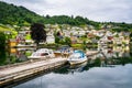 Amazing view of the pier with boats in Norheimsund near Steinsdalsfossen. Location: Norheimsund, Hardangerfjord, Norway.