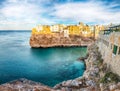 Amazing view on Polignano a Mare village on the rocks at sunset Royalty Free Stock Photo