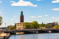 Amazing view on Riddarfjardenv bay, bridge, cityscape and the Stockholm City Hall Tower, the building of the Municipal Council for Royalty Free Stock Photo