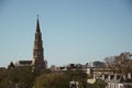 Amazing view from a rooftop of a hip trendy city town with tall church steeple in the midst Royalty Free Stock Photo