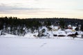 Amazing view of snowy coast of the frozen Baltic sea in winter evening. Sunset colorful sky. Royalty Free Stock Photo