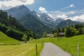 Amazing view of the snowy mountain peaks of the Swiss Alps from the small resort village of Champery in Switzerland. Bright blue Royalty Free Stock Photo