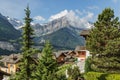 Amazing view of the snowy mountain peaks of the Swiss Alps from the small resort village of Champery in Switzerland. Bright blue Royalty Free Stock Photo