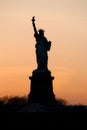 Amazing view of the Statue of Liberty, at sunset. New York icon Royalty Free Stock Photo