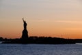 Amazing view of american icon the Statue of Liberty, at sunset. Space for text