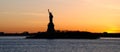 Panorama of New York. View of the Statue of Liberty, at sunset Royalty Free Stock Photo