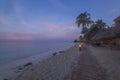 Amazing view of sunset with turquoise water Atlantic ocean on sand beach of Aruba Island. Royalty Free Stock Photo