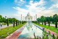 Amazing view on the Taj Mahal with reflection in water. The Taj Mahal is the best example of Mughal architecture, it attracts