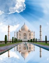 Amazing view on the Taj Mahal in sunset light with reflection in water. The Taj Mahal is an ivory-white marble mausoleum on the Royalty Free Stock Photo