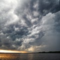 Amazing view of thunderstorm clouds above water Royalty Free Stock Photo
