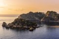 amazing view to a rocky coast and beautiful isle in sea with nice coasline and clouds on the background of the evening sea