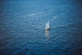 Amazing view to Yacht sailing in open sea at windy day. Drone view - birds eye angle. Yachting theme. Royalty Free Stock Photo