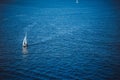 Amazing view to Yacht sailing in open sea at windy day. Drone view - birds eye angle. Yachting theme. Royalty Free Stock Photo