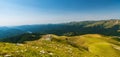 Amazing view during trekkin in Valcan mountains in Romania with Ivovanului lake and many hills
